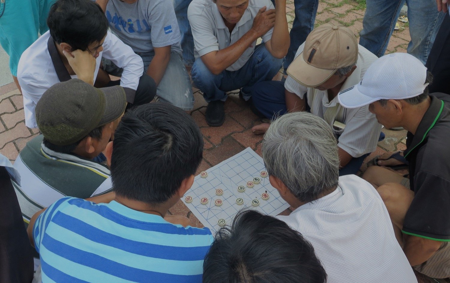 people playing vietnamese game on the road naturebels
